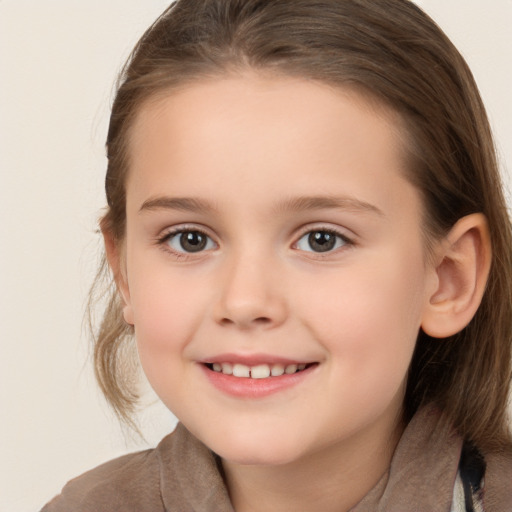 Joyful white child female with medium  brown hair and brown eyes