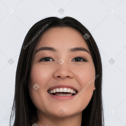 Joyful white young-adult female with long  black hair and brown eyes