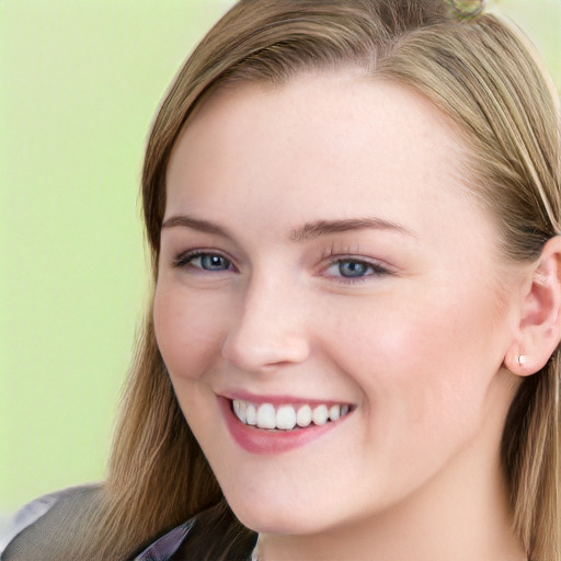 Joyful white young-adult female with long  brown hair and blue eyes