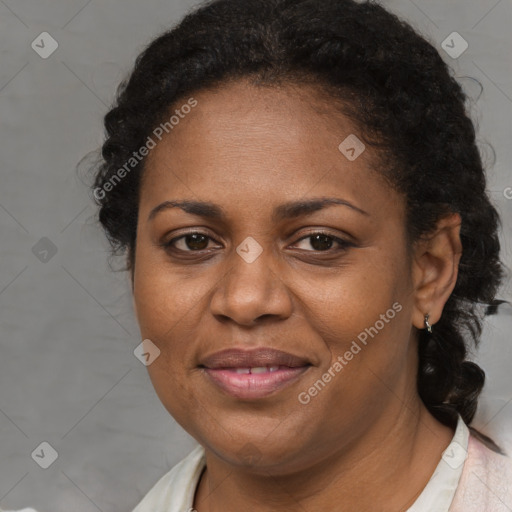 Joyful black adult female with short  brown hair and brown eyes