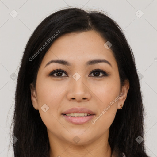 Joyful latino young-adult female with long  brown hair and brown eyes