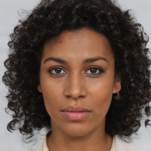 Neutral black young-adult female with medium  brown hair and brown eyes