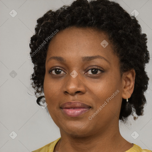 Joyful black young-adult female with medium  black hair and brown eyes