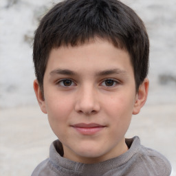 Joyful white child male with short  brown hair and brown eyes