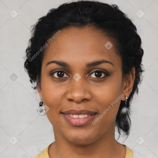 Joyful black young-adult female with short  black hair and brown eyes