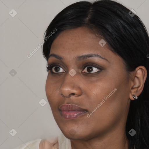 Joyful asian young-adult female with long  black hair and brown eyes