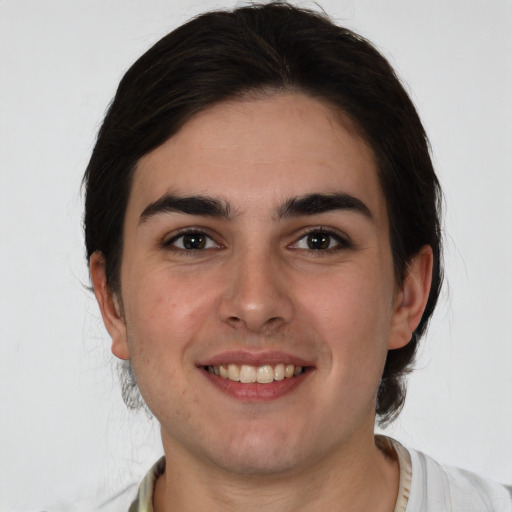 Joyful white young-adult male with medium  brown hair and brown eyes