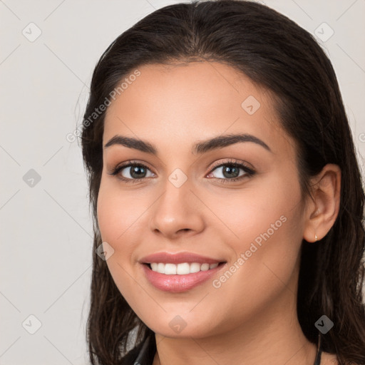 Joyful white young-adult female with long  brown hair and brown eyes