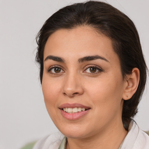Joyful white young-adult female with medium  brown hair and brown eyes