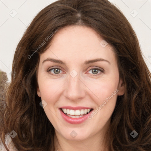 Joyful white young-adult female with long  brown hair and green eyes