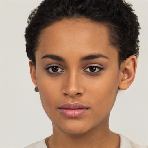 Joyful latino young-adult female with short  brown hair and brown eyes