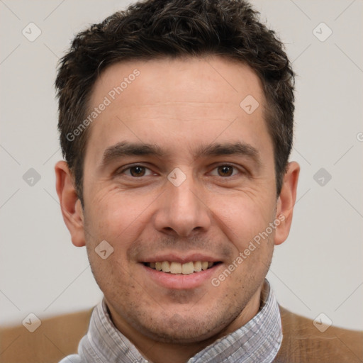 Joyful white adult male with short  brown hair and brown eyes