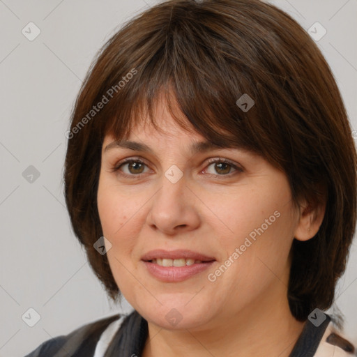 Joyful white adult female with medium  brown hair and grey eyes