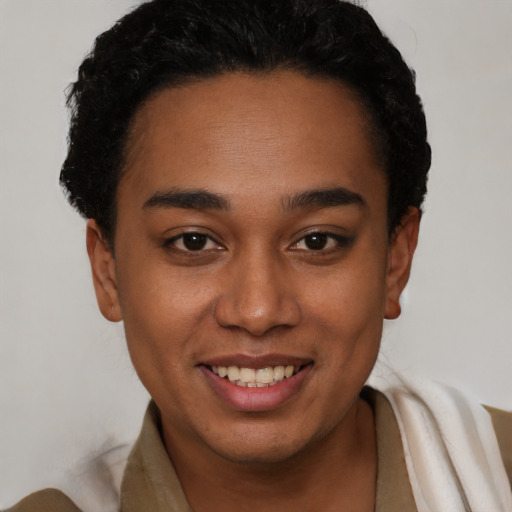Joyful latino young-adult female with short  black hair and brown eyes