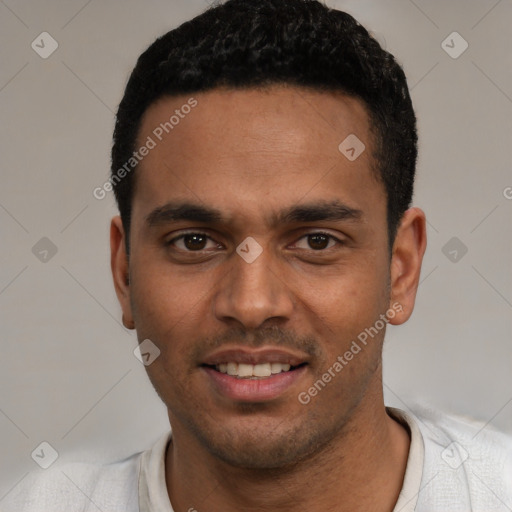 Joyful white young-adult male with short  black hair and brown eyes