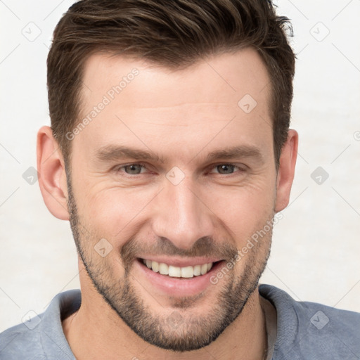 Joyful white young-adult male with short  brown hair and brown eyes