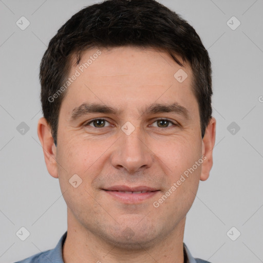 Joyful white adult male with short  brown hair and brown eyes