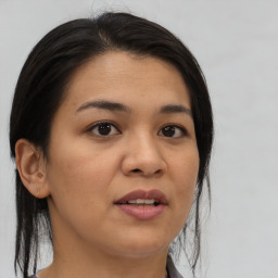 Joyful white young-adult female with medium  brown hair and brown eyes