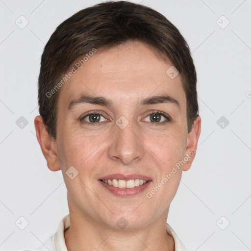 Joyful white young-adult female with short  brown hair and grey eyes