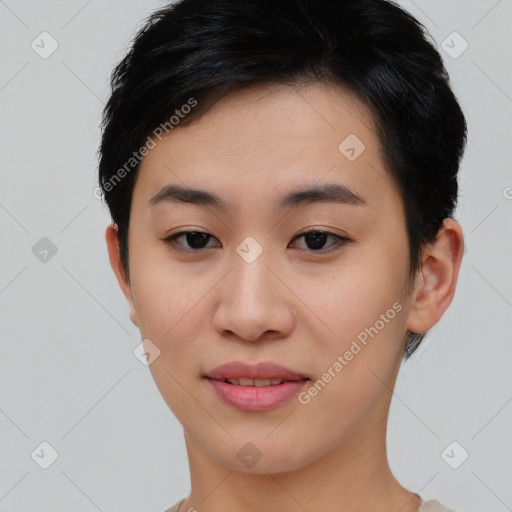 Joyful asian young-adult female with short  brown hair and brown eyes