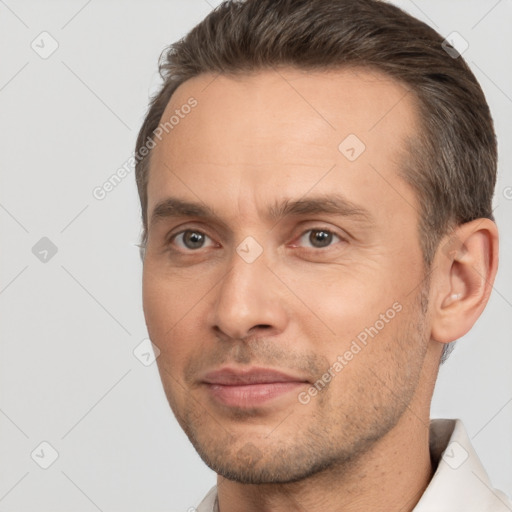 Joyful white adult male with short  brown hair and brown eyes