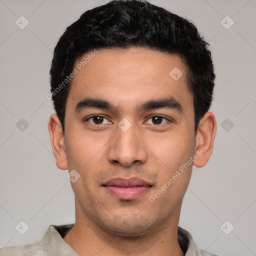 Joyful white young-adult male with short  black hair and brown eyes