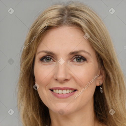 Joyful white adult female with long  brown hair and brown eyes