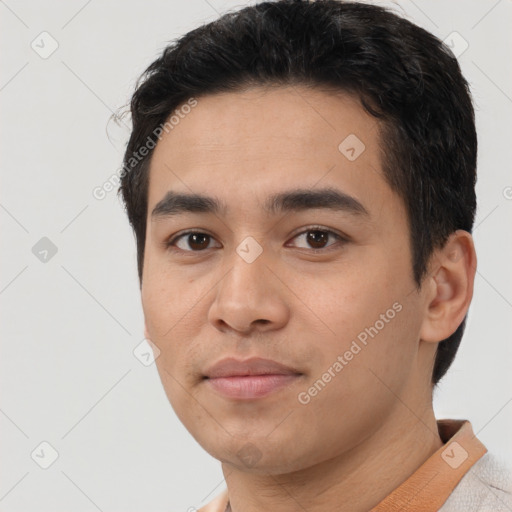 Joyful white young-adult male with short  black hair and brown eyes