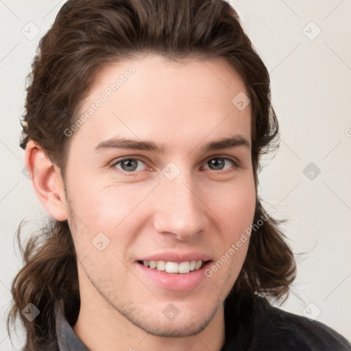 Joyful white young-adult male with medium  brown hair and brown eyes