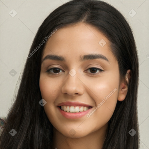 Joyful latino young-adult female with long  black hair and brown eyes