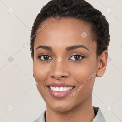 Joyful latino young-adult female with short  brown hair and brown eyes