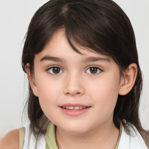 Joyful white child female with medium  brown hair and brown eyes