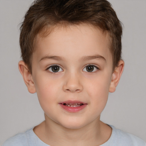 Joyful white child male with short  brown hair and brown eyes