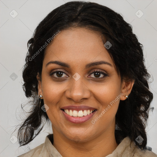 Joyful black young-adult female with long  brown hair and brown eyes