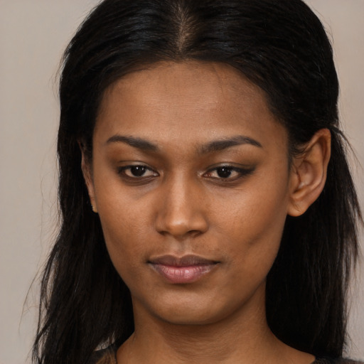 Neutral black young-adult female with long  brown hair and brown eyes