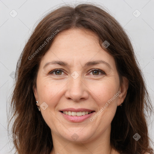 Joyful white adult female with long  brown hair and brown eyes