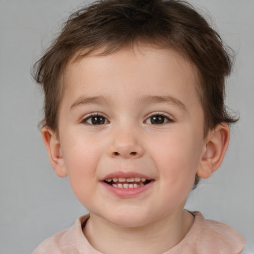 Joyful white child male with short  brown hair and brown eyes