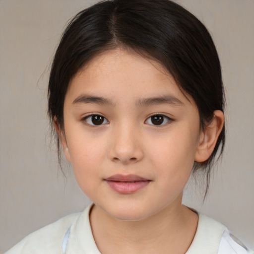 Joyful white child female with medium  brown hair and brown eyes