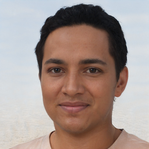 Joyful latino young-adult male with short  black hair and brown eyes