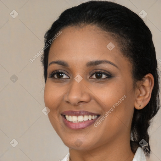 Joyful black young-adult female with medium  brown hair and brown eyes