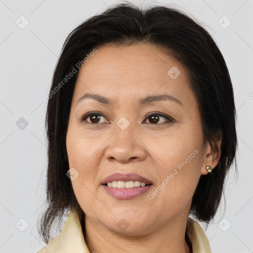 Joyful white adult female with medium  brown hair and brown eyes