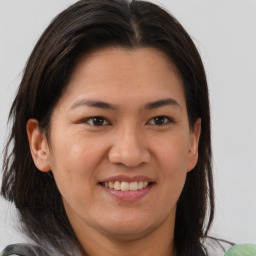 Joyful white young-adult female with medium  brown hair and brown eyes