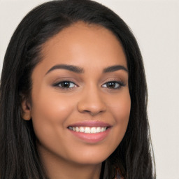 Joyful latino young-adult female with long  brown hair and brown eyes