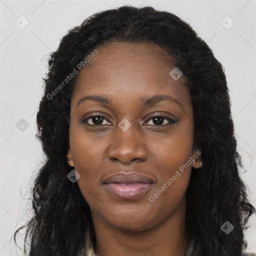 Joyful black young-adult female with long  black hair and brown eyes