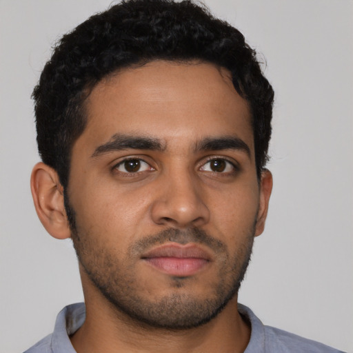 Neutral latino young-adult male with short  brown hair and brown eyes