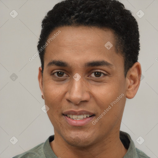 Joyful black young-adult male with short  black hair and brown eyes