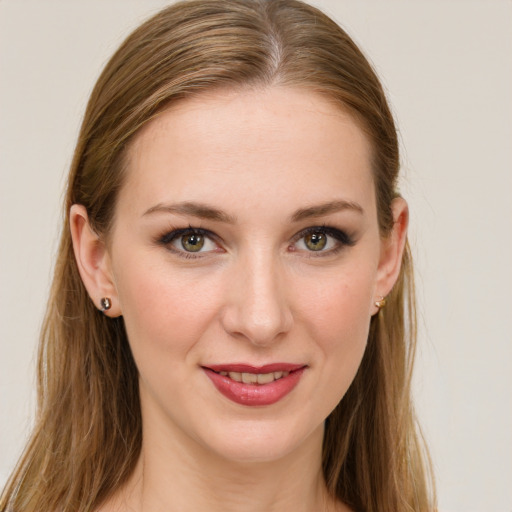 Joyful white young-adult female with long  brown hair and grey eyes