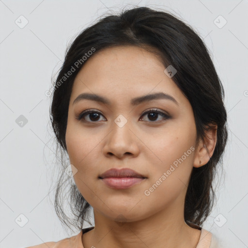 Joyful asian young-adult female with long  brown hair and brown eyes