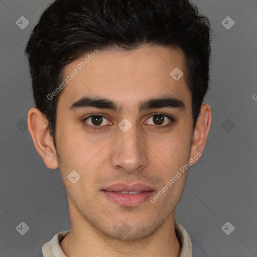 Joyful latino young-adult male with short  brown hair and brown eyes