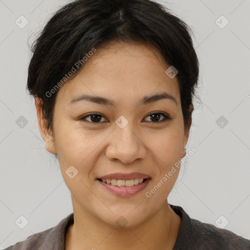 Joyful asian young-adult female with short  brown hair and brown eyes